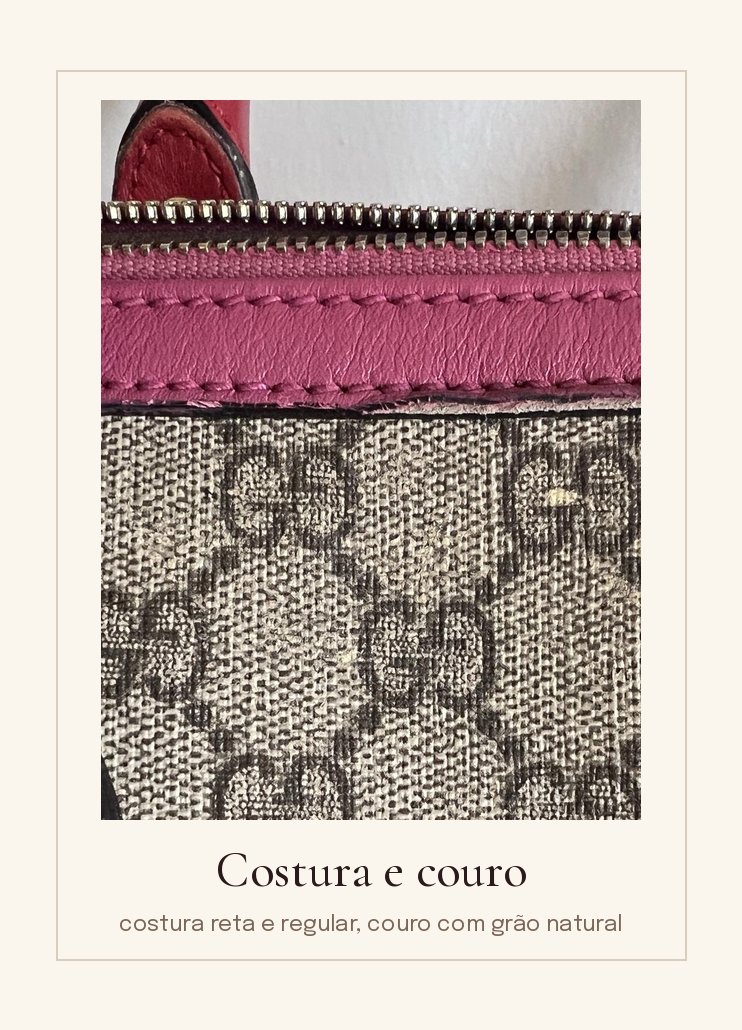 Costura reta e regular em couro rosa junto ao zíper